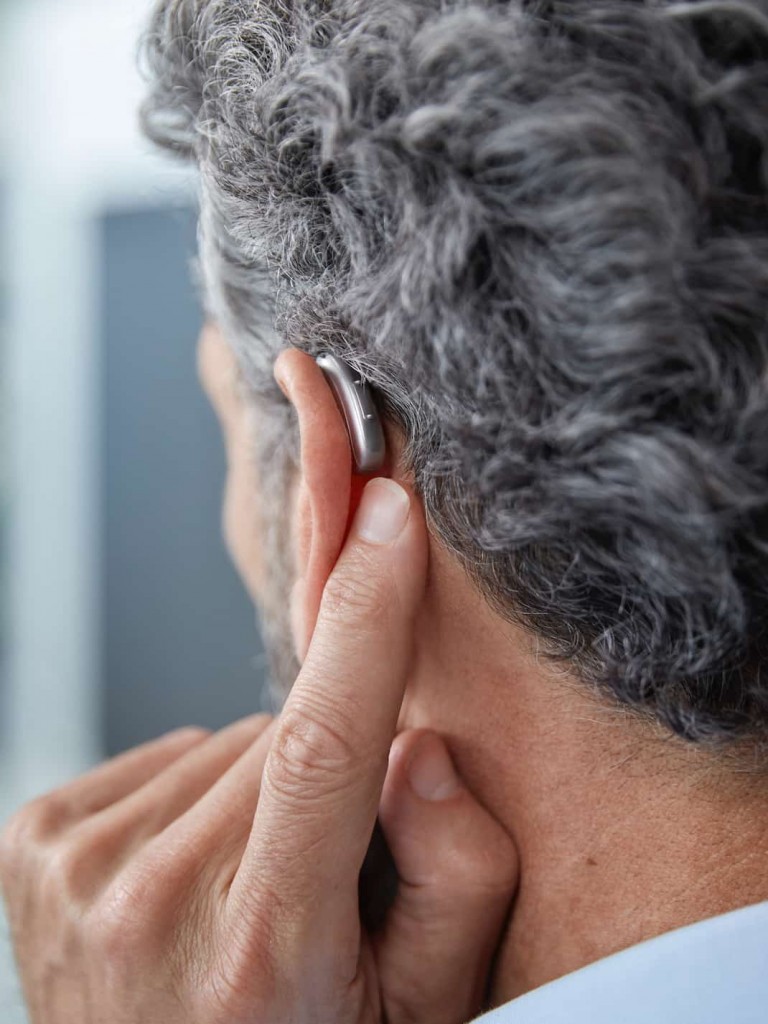 How to stop a hearing aid from whistling or buzzing?